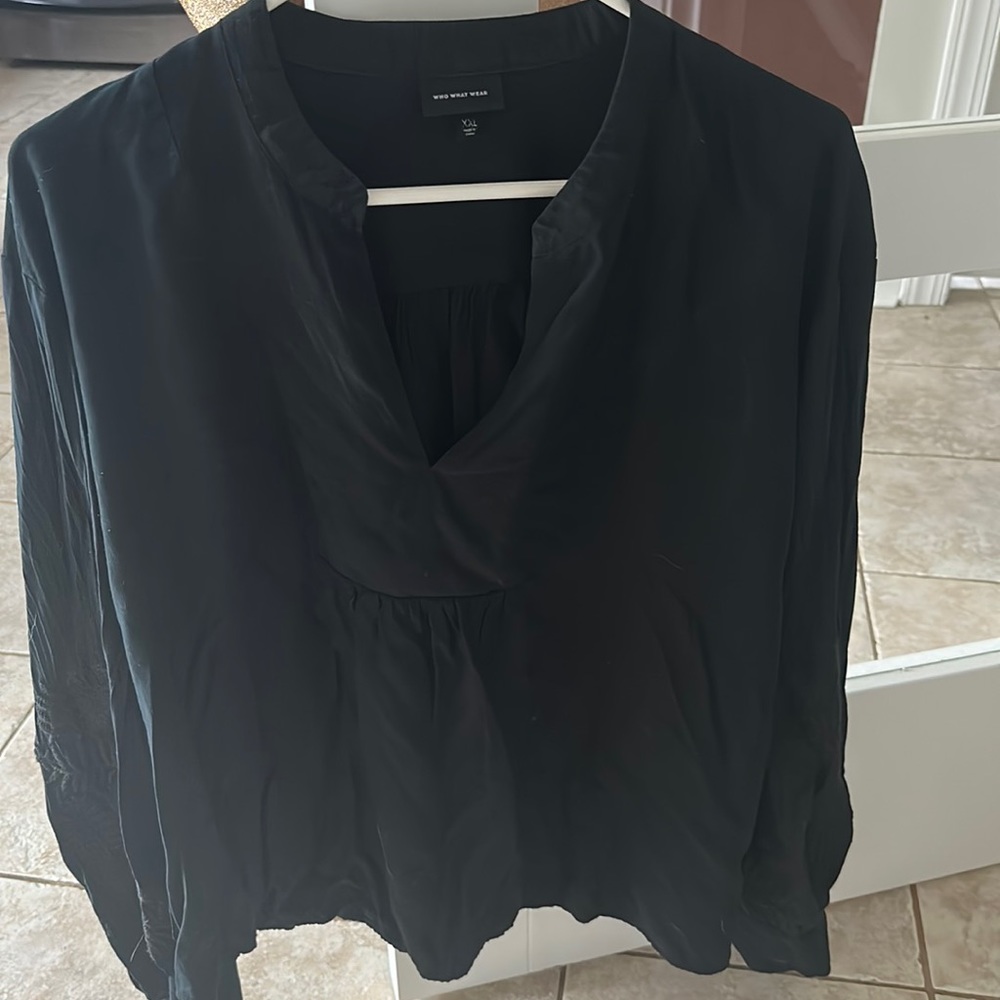 Black blouse with e pride red detail on sleeve